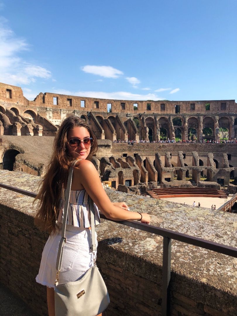 Kierstyn standing inside Colesium in Rome, Italy
