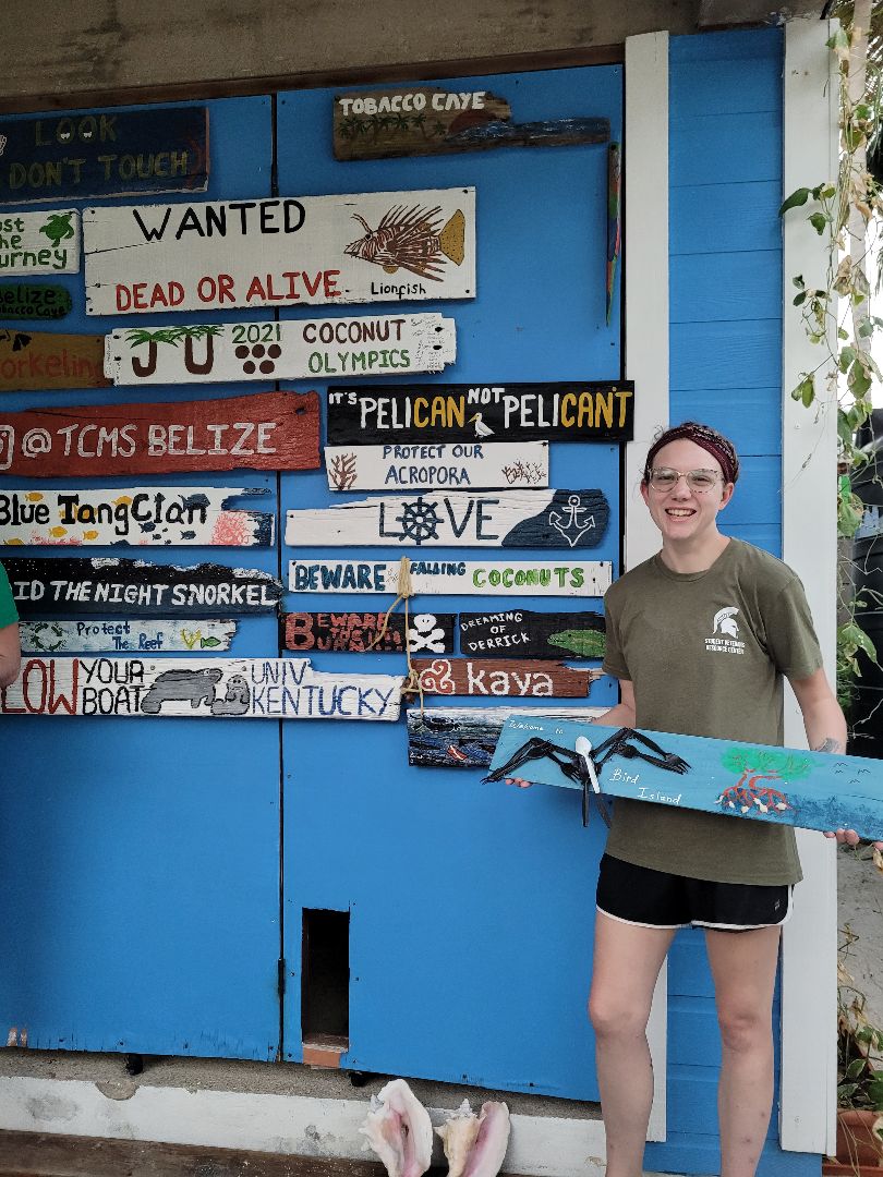 Sarah in Belize holding sign