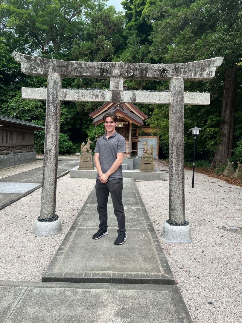 Jesse standing in front of shrine