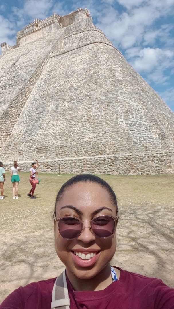 Amirah taking a selfie in front of Mayan ruins