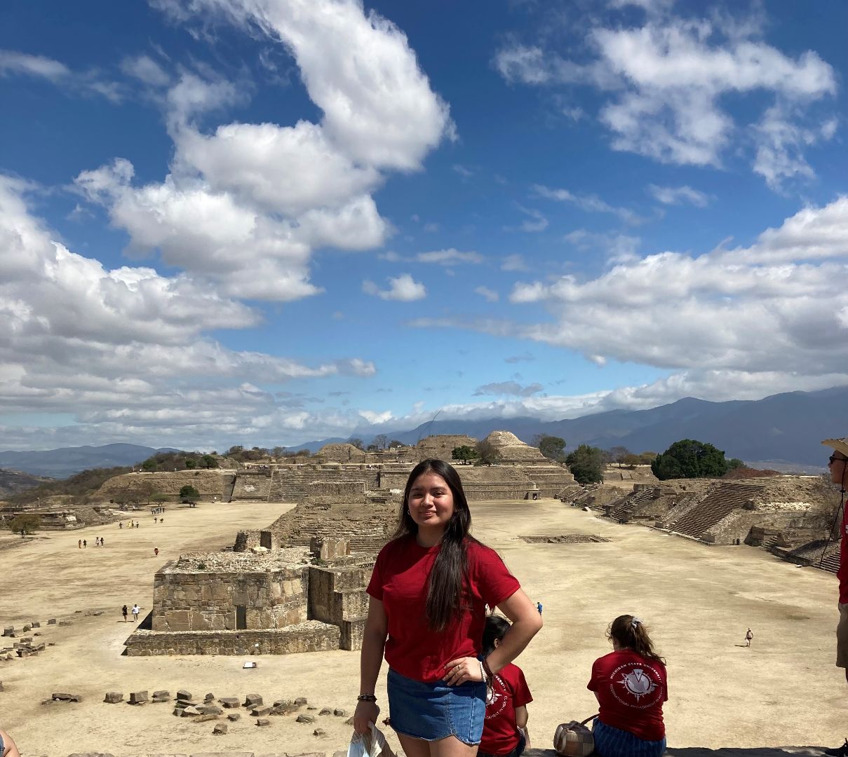 Luz standing in front of ruins in Mexico