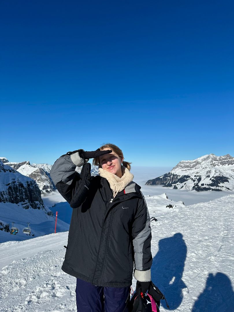 Breanne on top of a mountain in the Swiss Alps