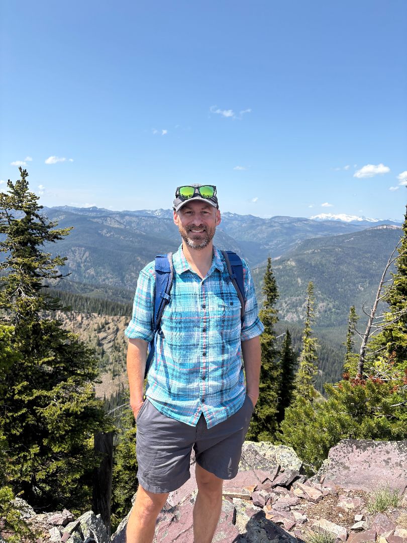 Andrew Finley outdoors on a mountain ridge