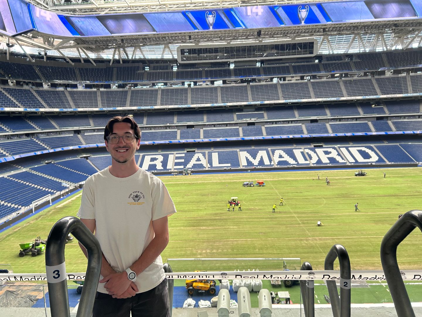 Evan standing in the Real Madrid stadium