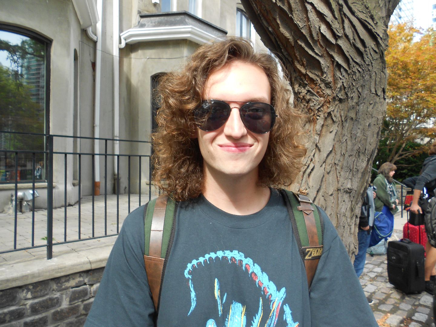 Jonathan wearing sunglasses on the streets of Toronto