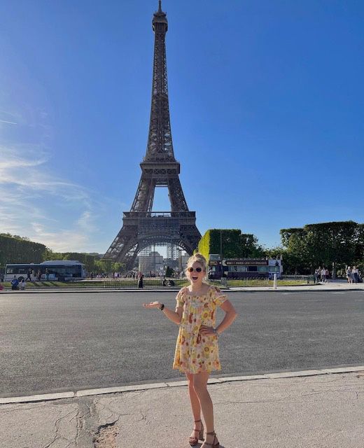 Lucille standing in front of Eiffel Tower in Paris