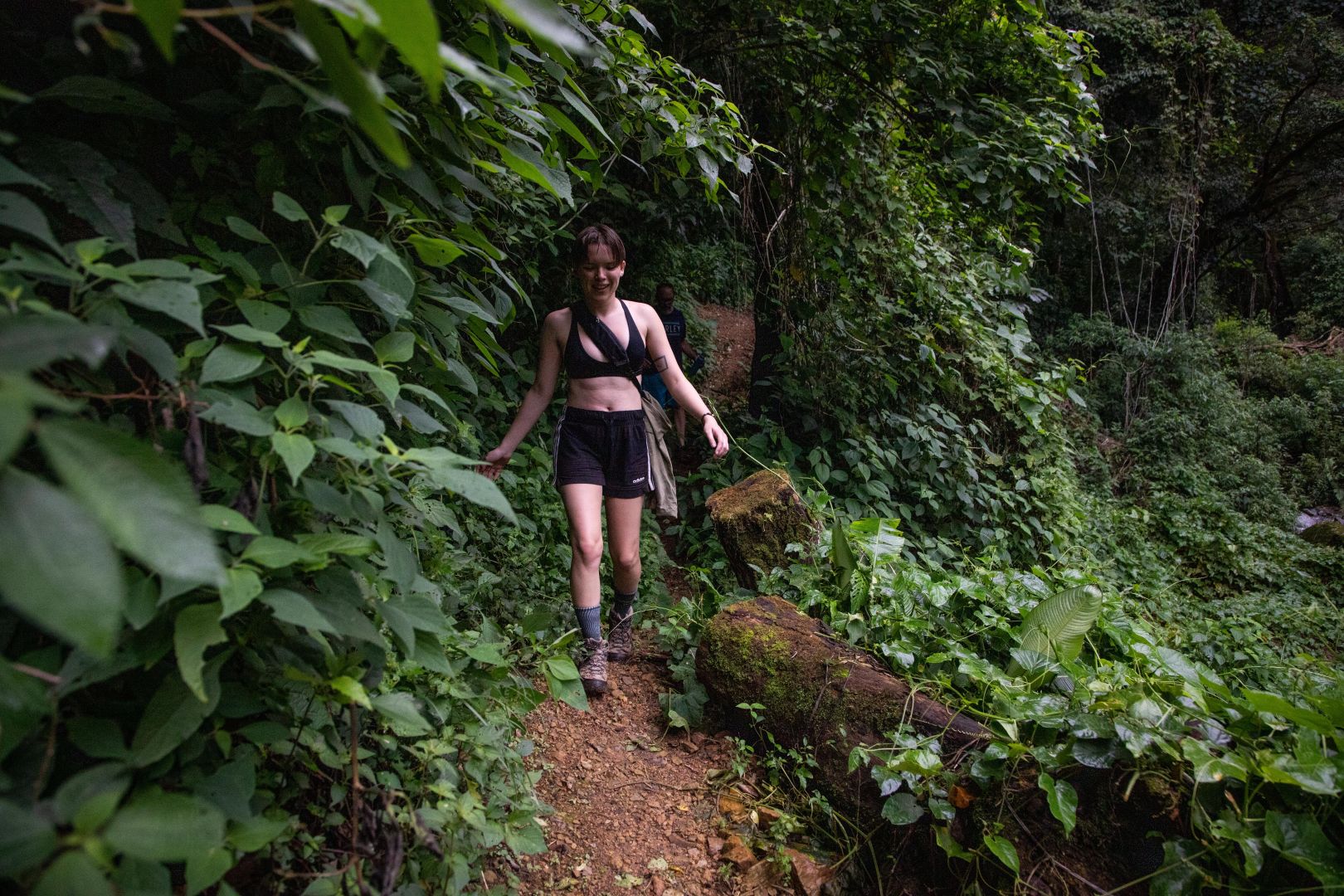 Hazel walking on a trail in the rain forest