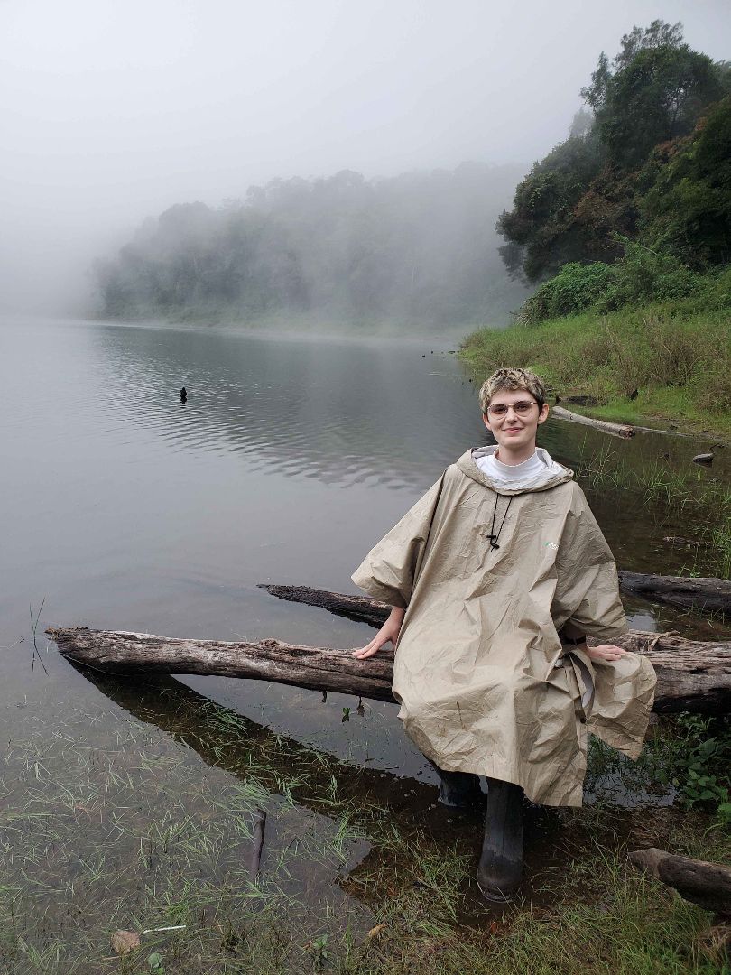 A. Proudfoot sitting by a volcanic lake in Panama