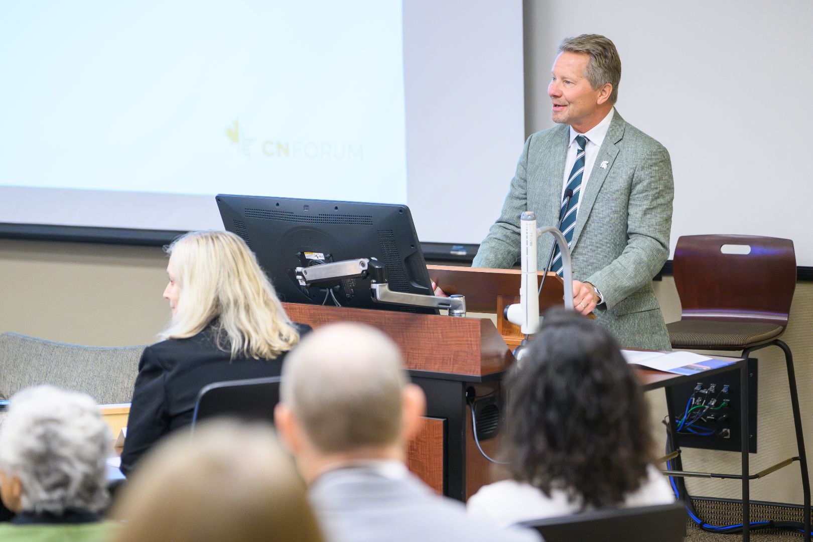 President Guskiewicz speaking to attendees