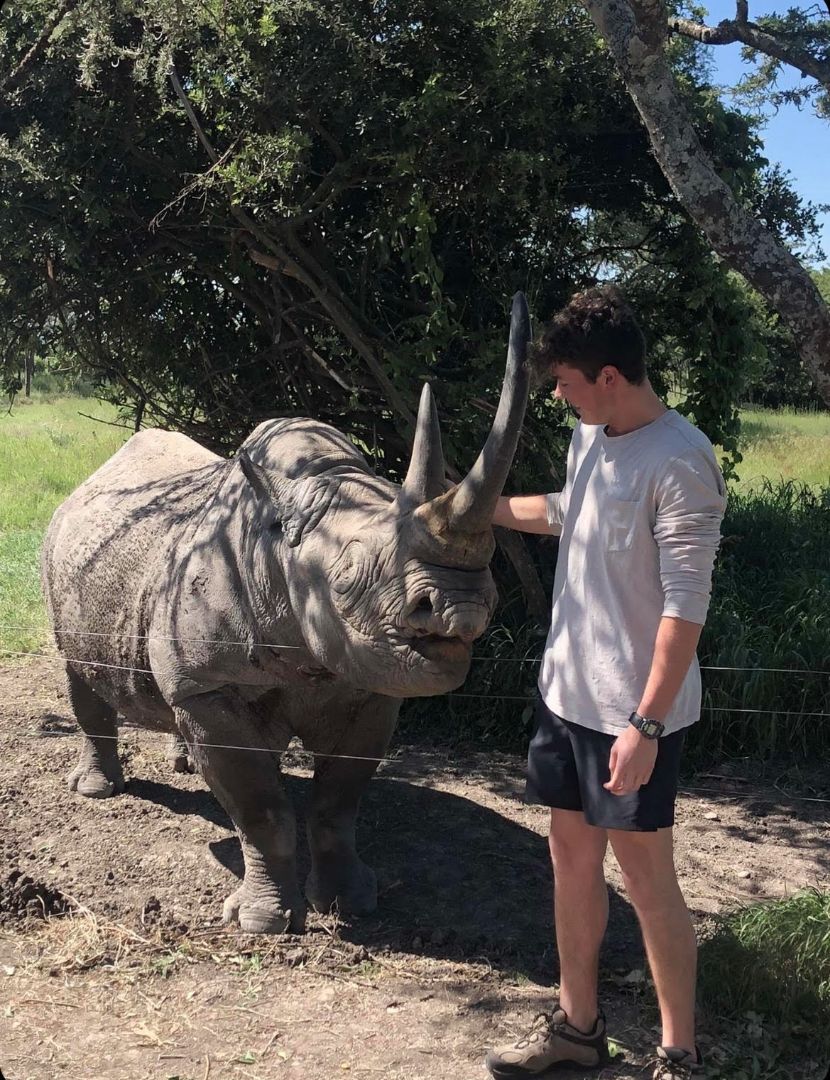 Kenny petting Baracka the rhino in Kenya