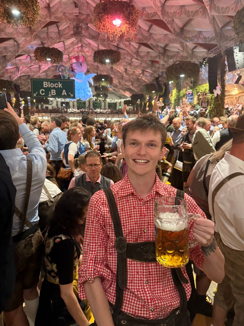 James holding a beer at Octoberfest in Munich Germany