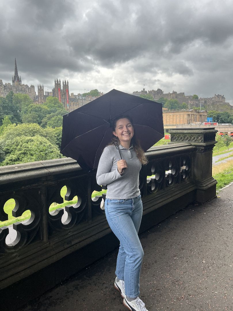 Ana holding an umbrella on a rainy day in Scotland