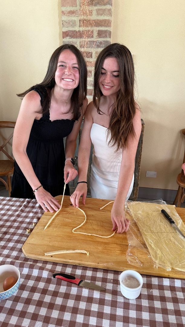 Julia and friend making pasta in Italy