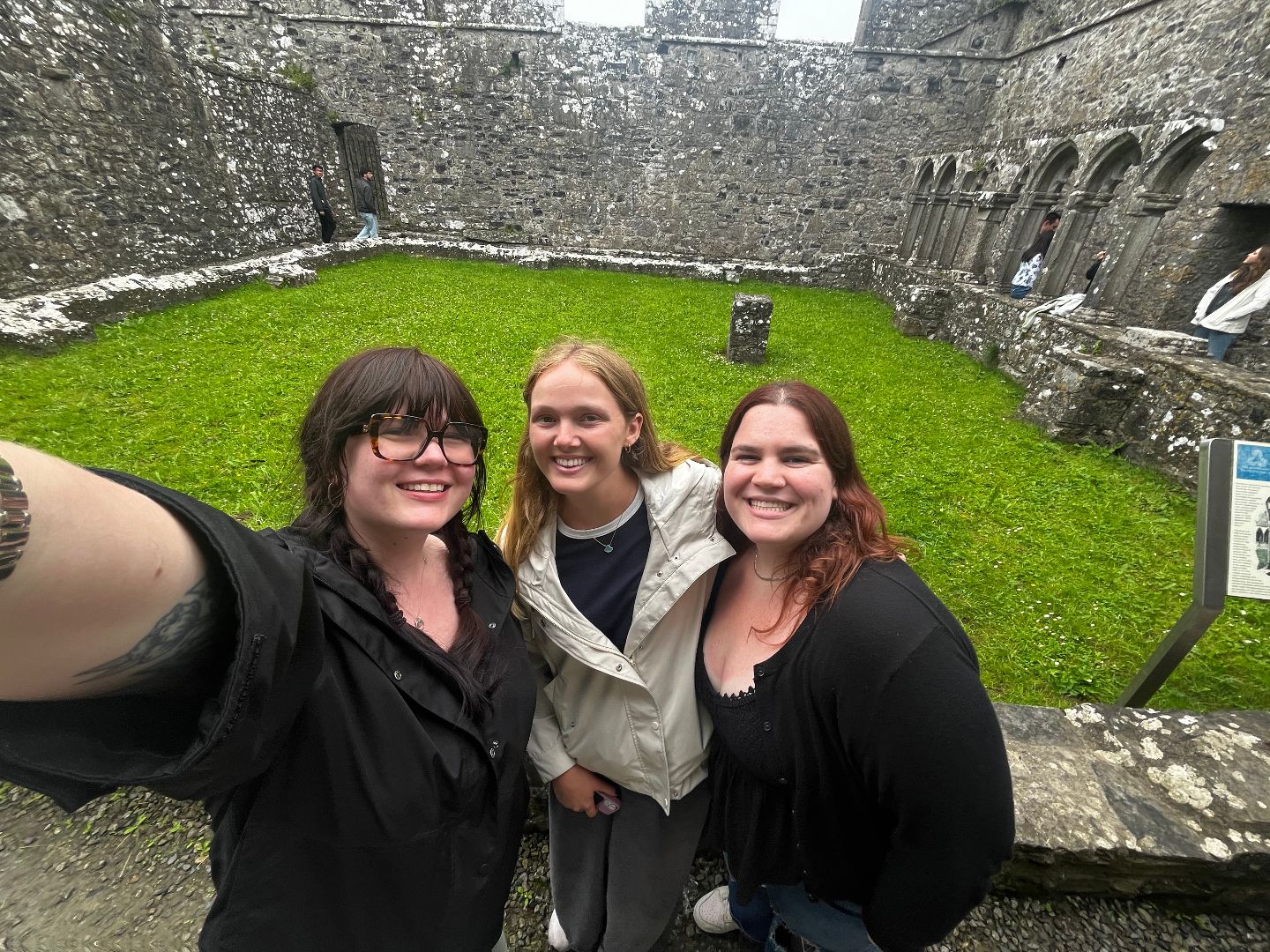 Natalie and friends take a selfie inside castle grounds