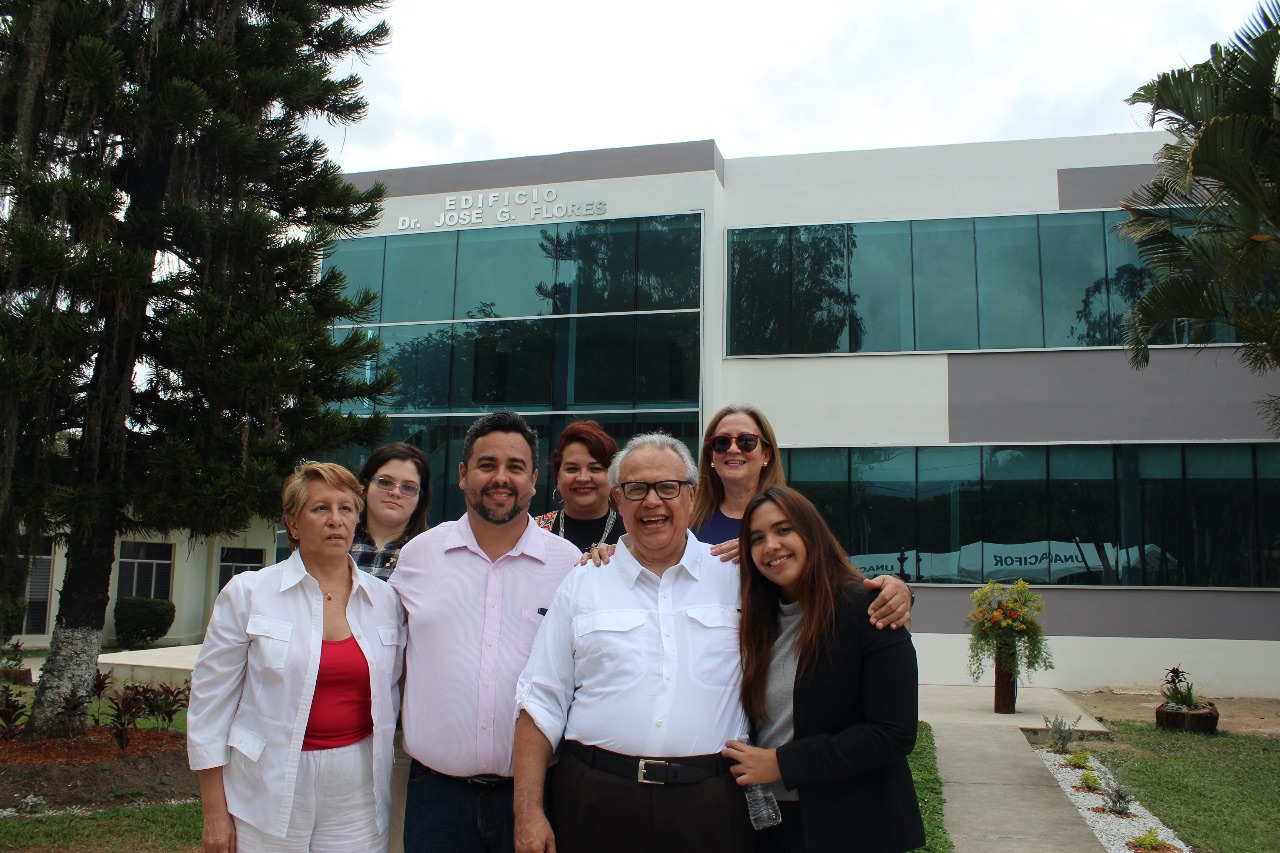 José with family and friends in front of a building named after him at the National Forestry University of Honduras