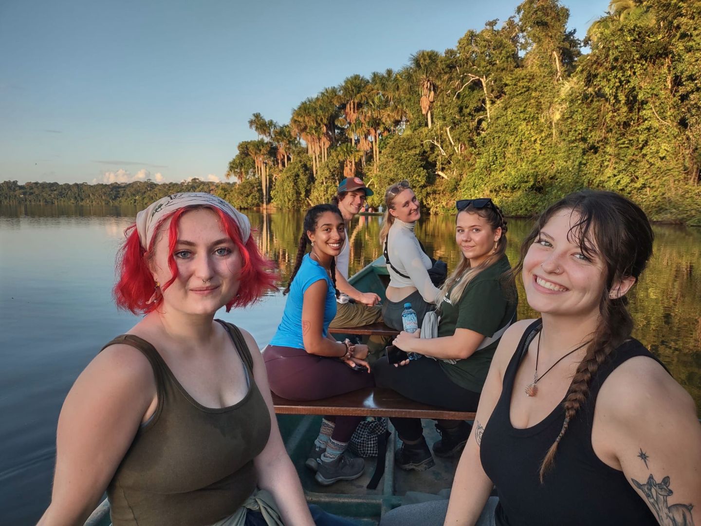 Anna and friends on a boat in the river in Peru