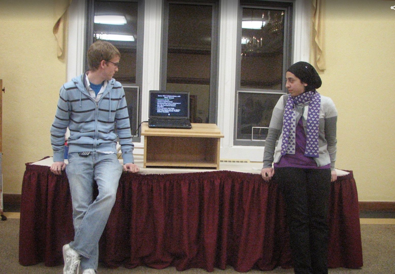 Nada and her future-husband Ryan presenting in a classroom