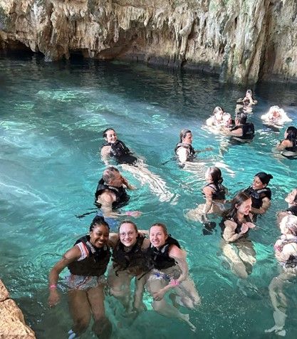 Students swimming in cenotes
