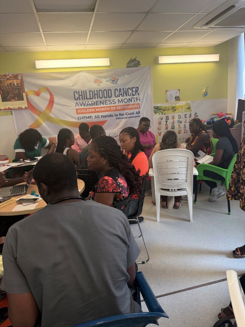 Classroom of MSU students with a childhood cancer awareness month poster on the wall