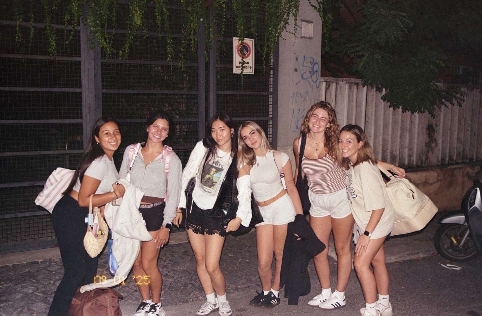 Group of students pose for a photo in the streets of Italy