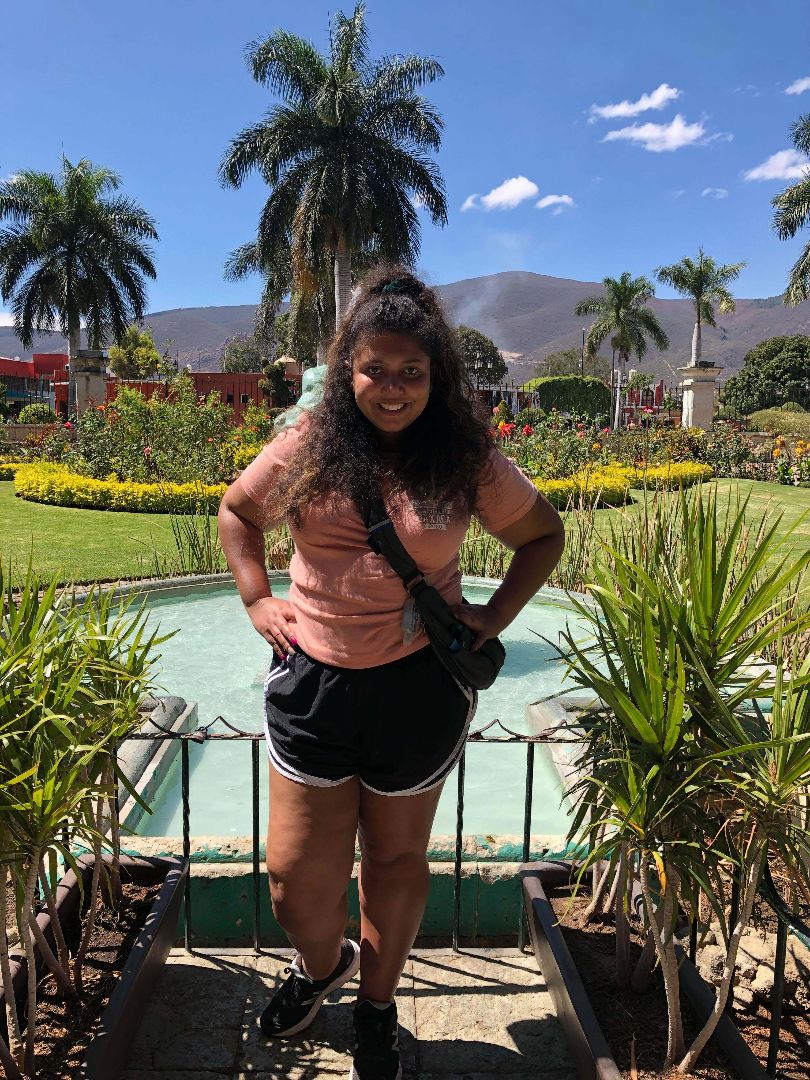 Arianna standing in front of fountain in Mexico