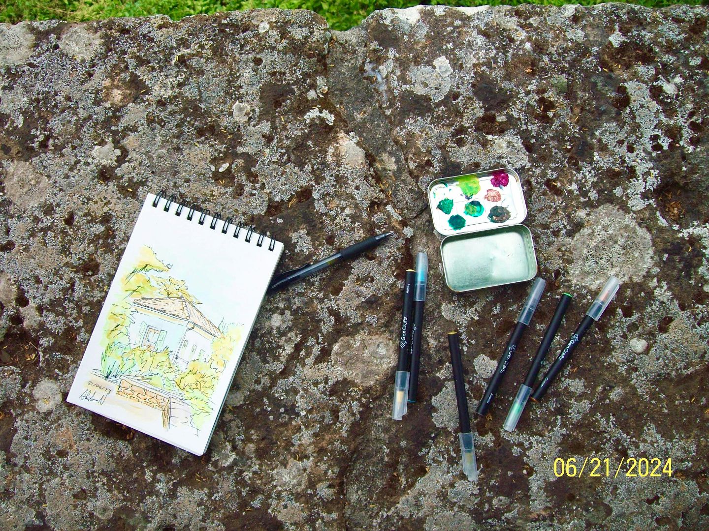 Photo of Alberto's sketchbook and paint pad