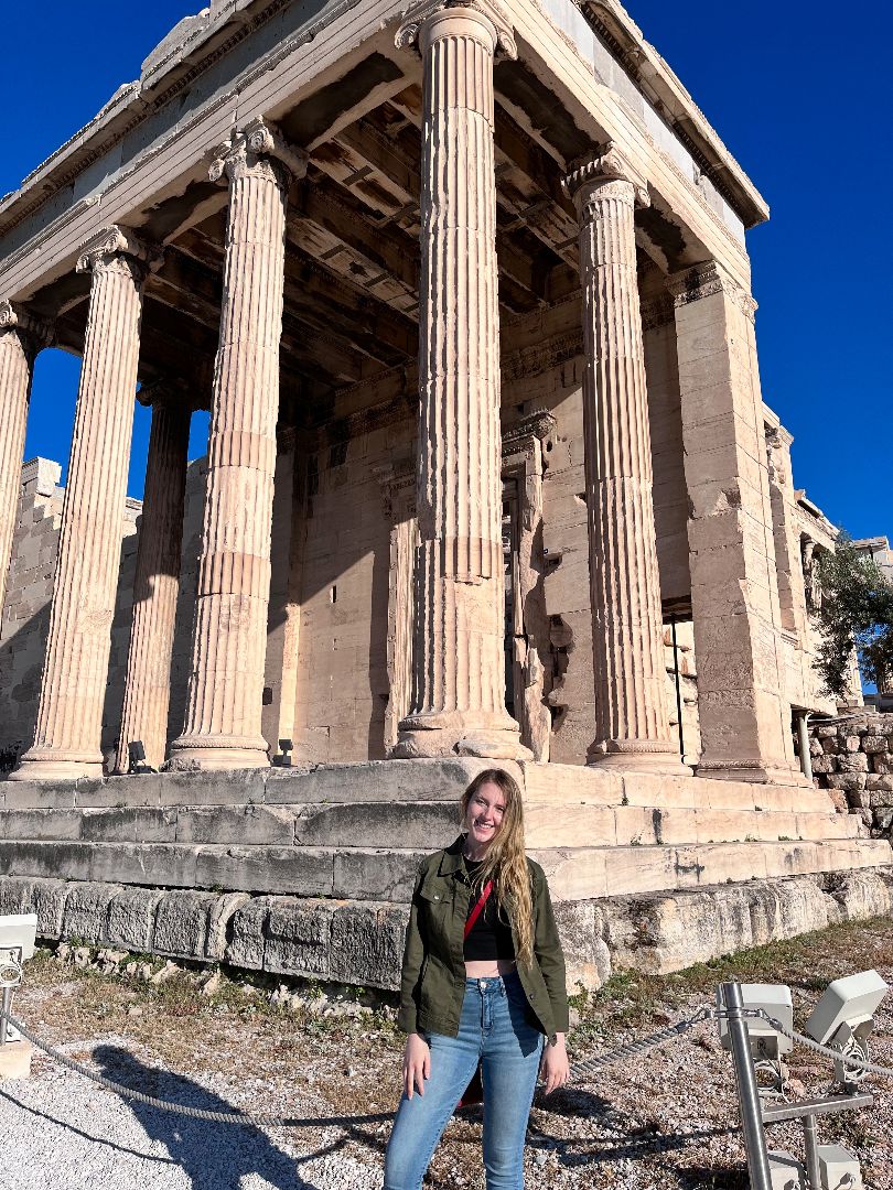Zoe standing in front of Acropolis in Athens, Greece