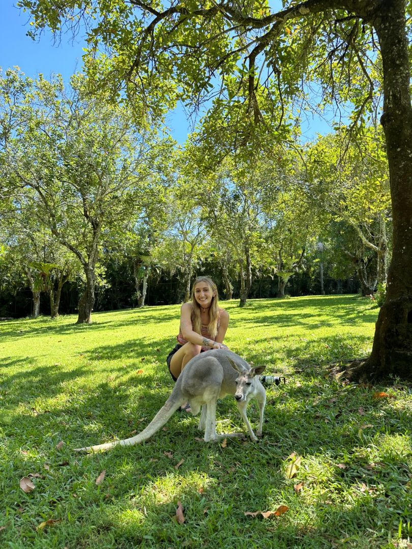 Cameryn with kangaroo in park in Australia