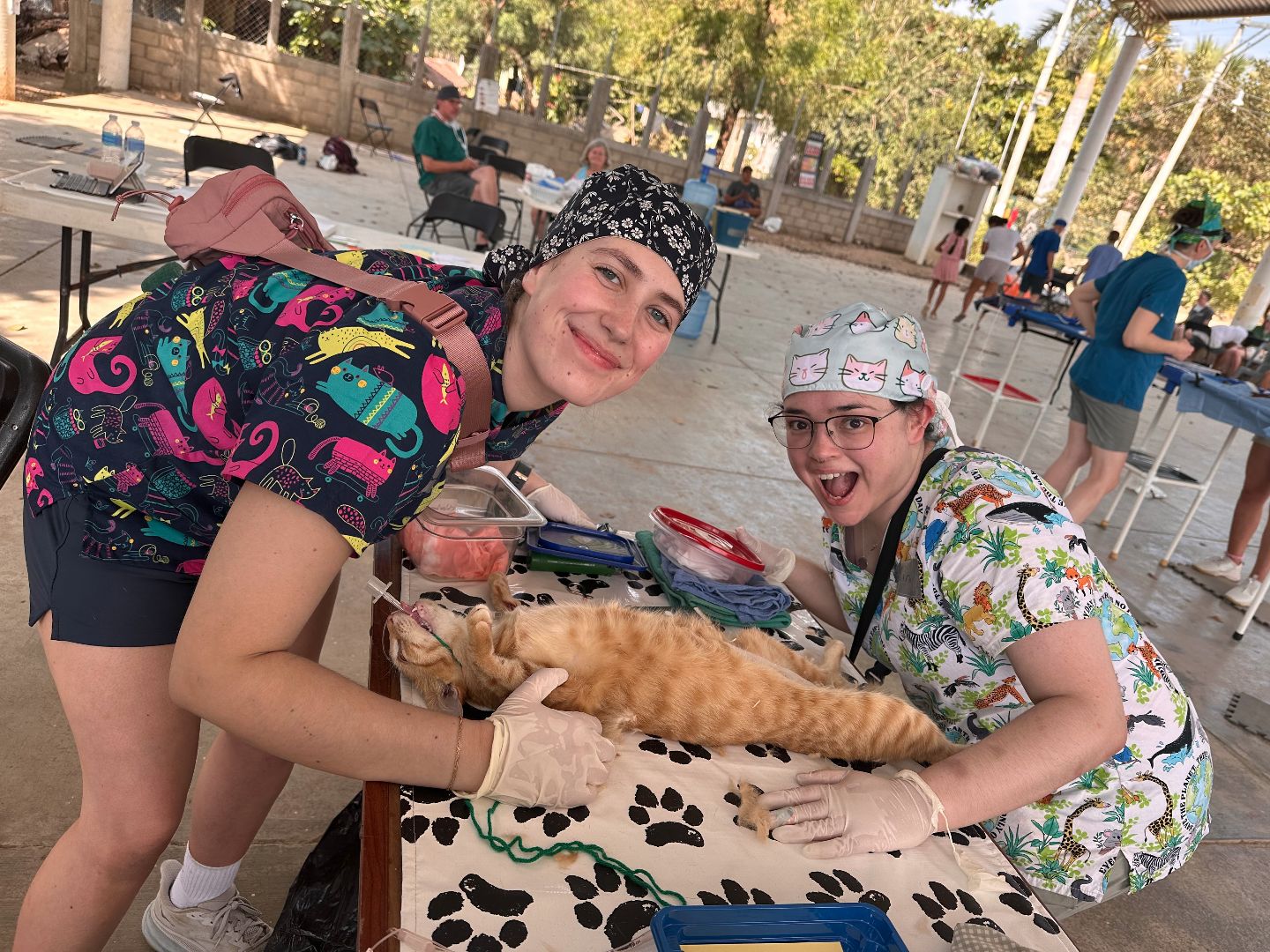 Emilee and friend posing with an intubated catelfie.jpg