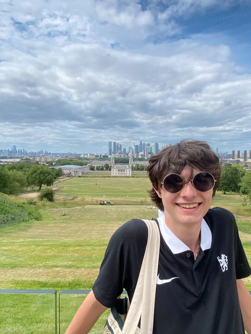 Nick overlooking a park with the London skyline in the background