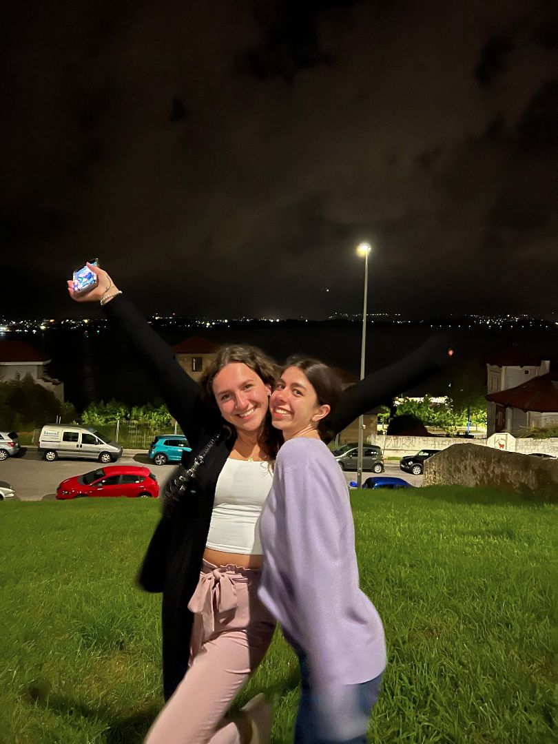 Natalie and another student posing for photo at night in Spain
