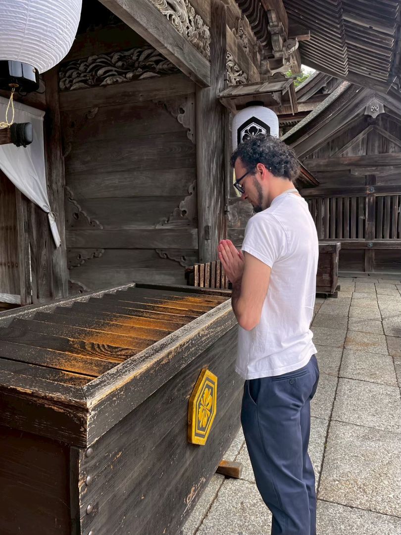 Miles praying in Japan
