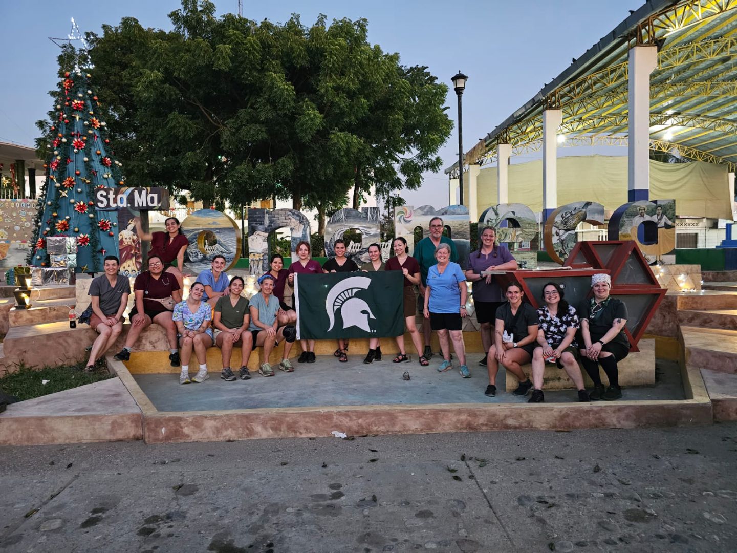 Group of students holding a Spartan flag in Mexico