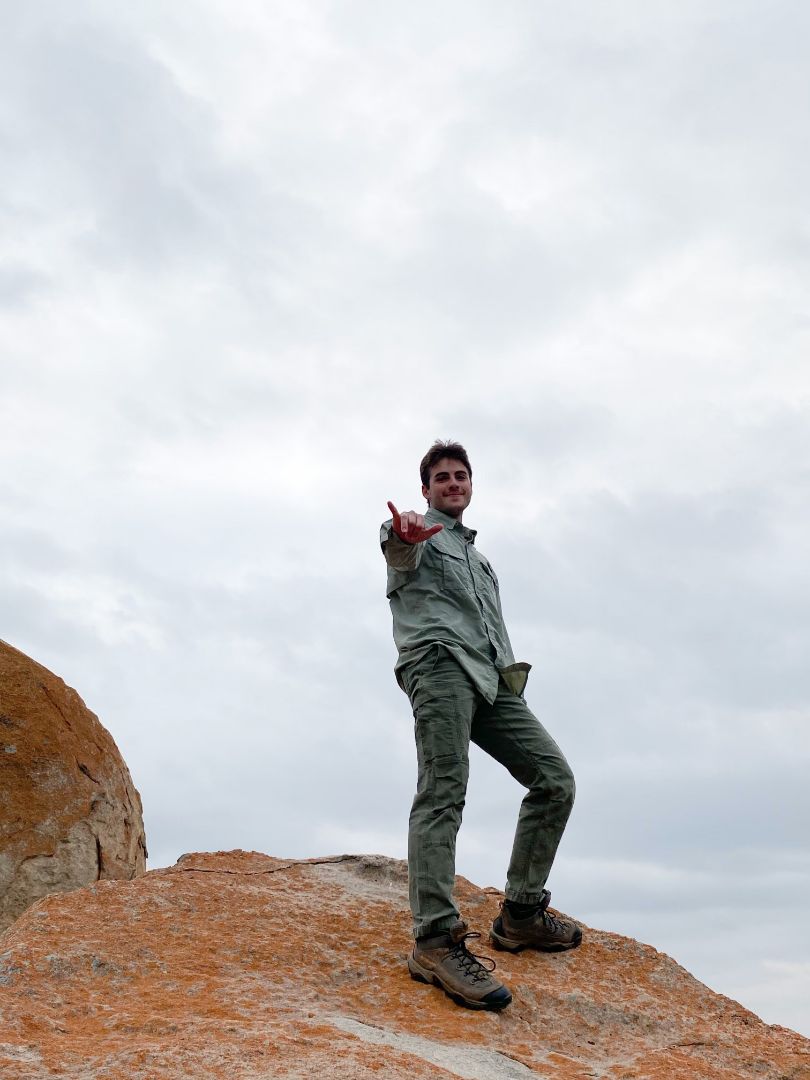Bennett standing on top of large rock in South Africa