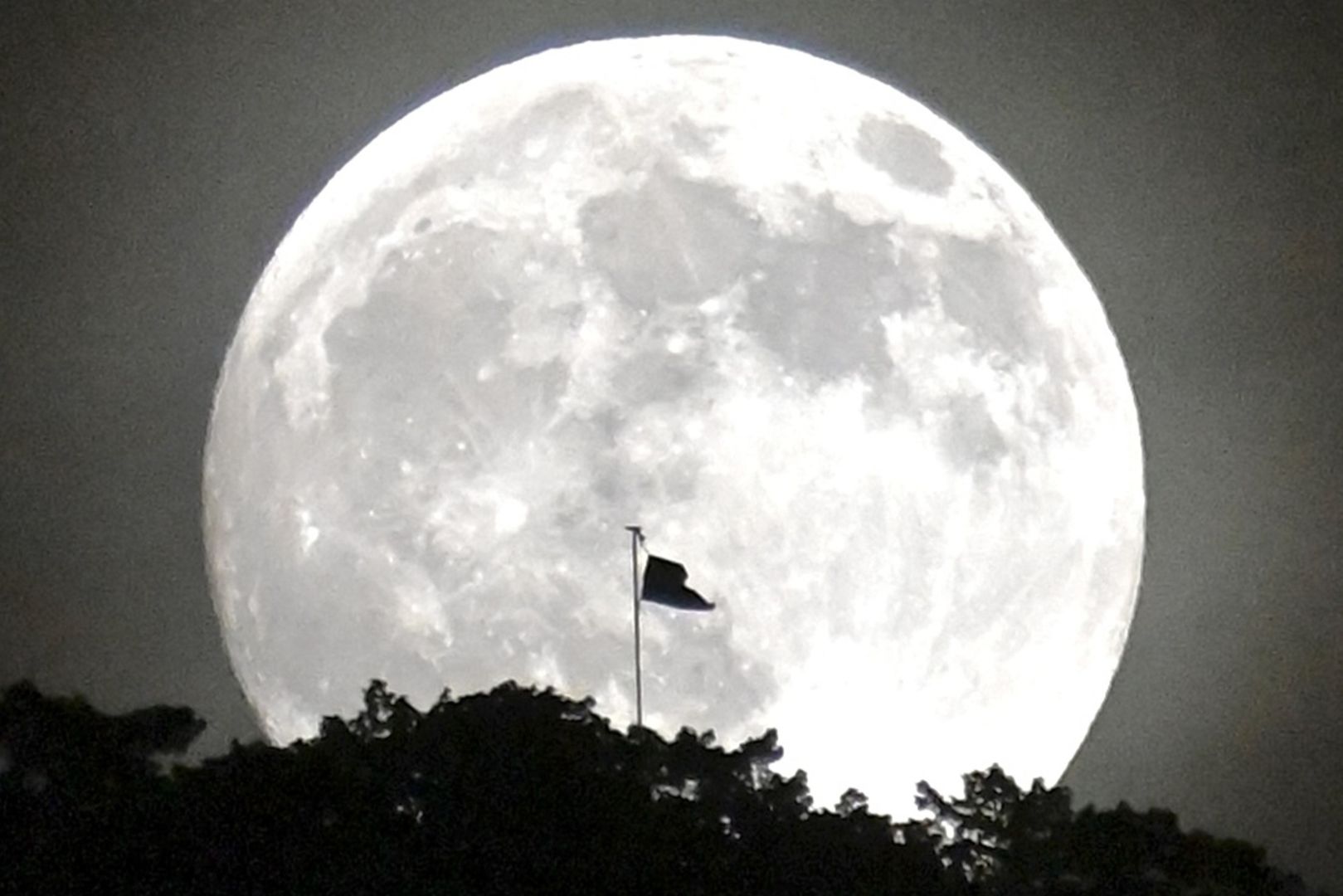 Flag at the Summit of Mt. Mikami Illuminated by the Moon