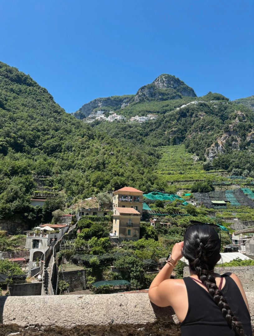 Saara looking a lush mountainside in Italy
