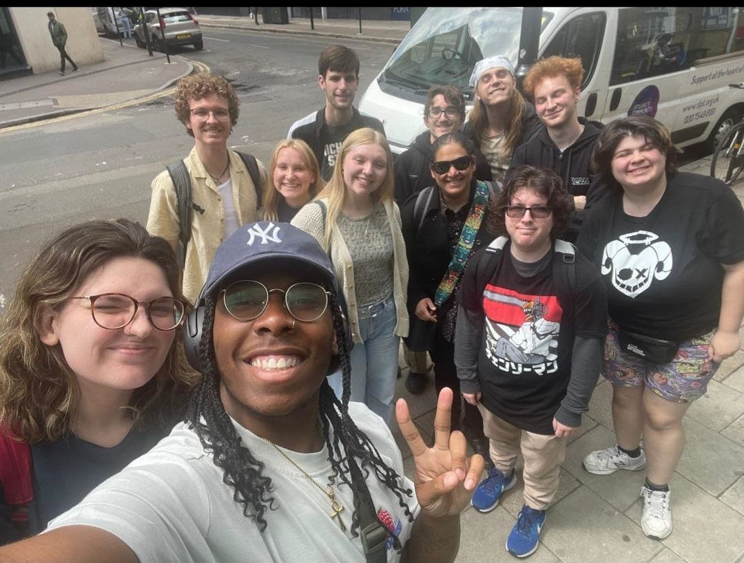 Sam and friends pose for a photo on the streets of London
