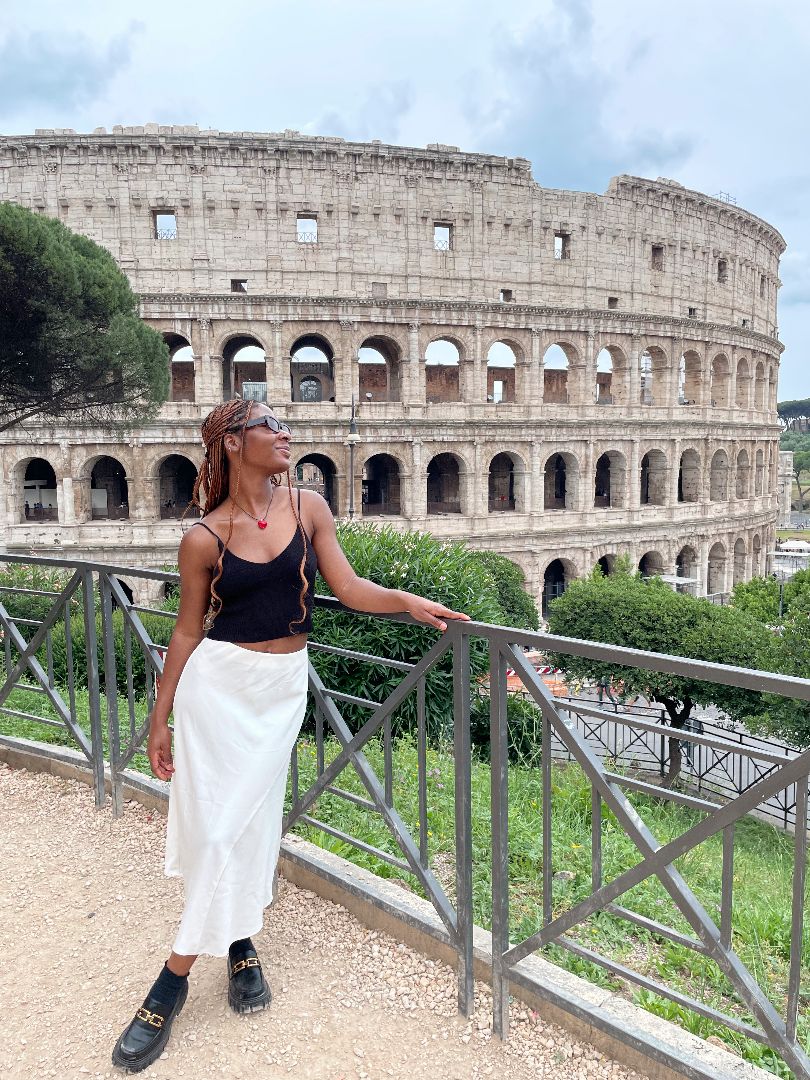 Kalila standing in front of the Colesium in Rome