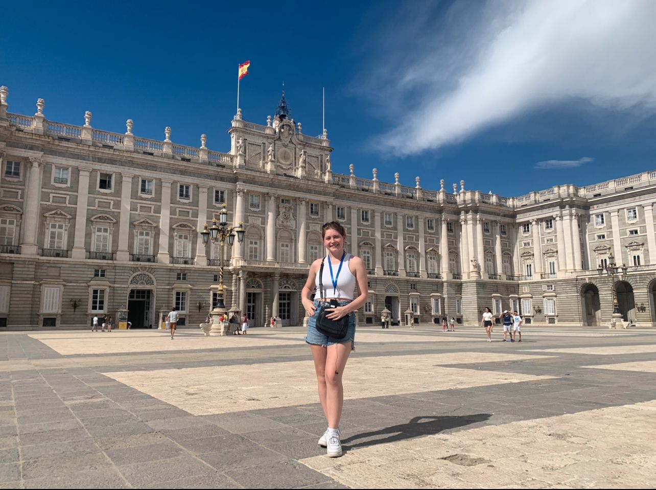 Elizabeth standing in front of the Royal Palace in Madrid