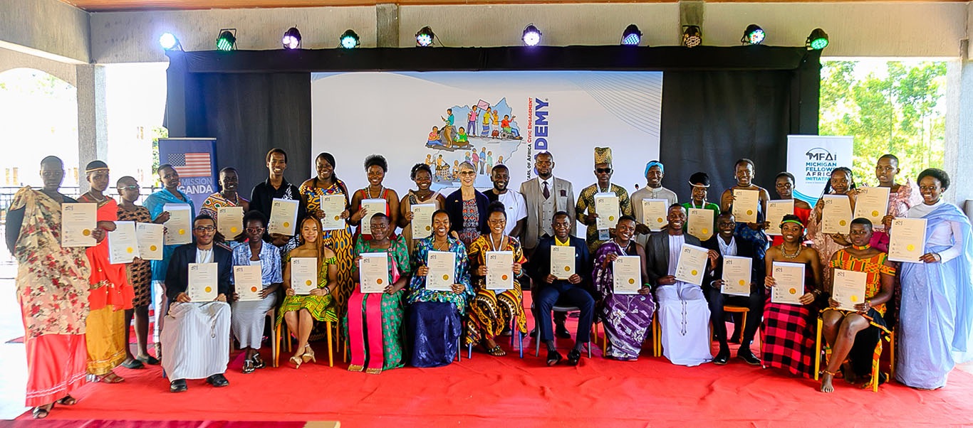 Group photo of people holding certificates