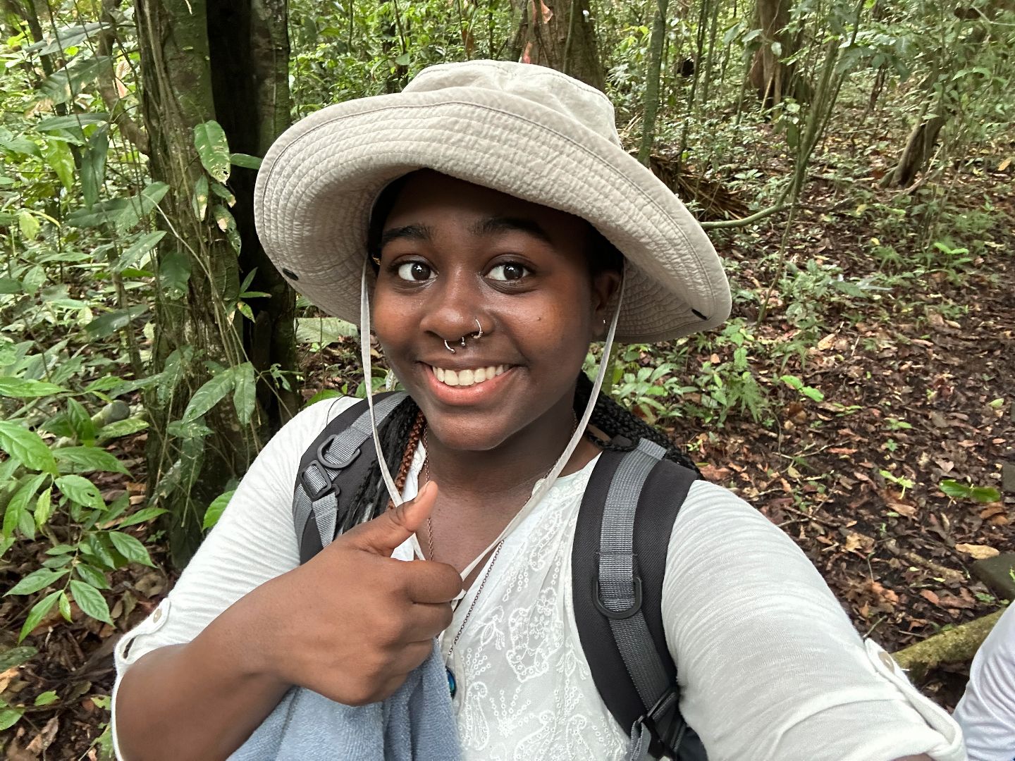 LaMonica giving a thumbs up in the rainforest in Panama