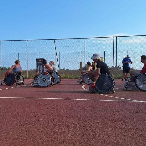 Students using wheelchairs in a sports setting in Greece