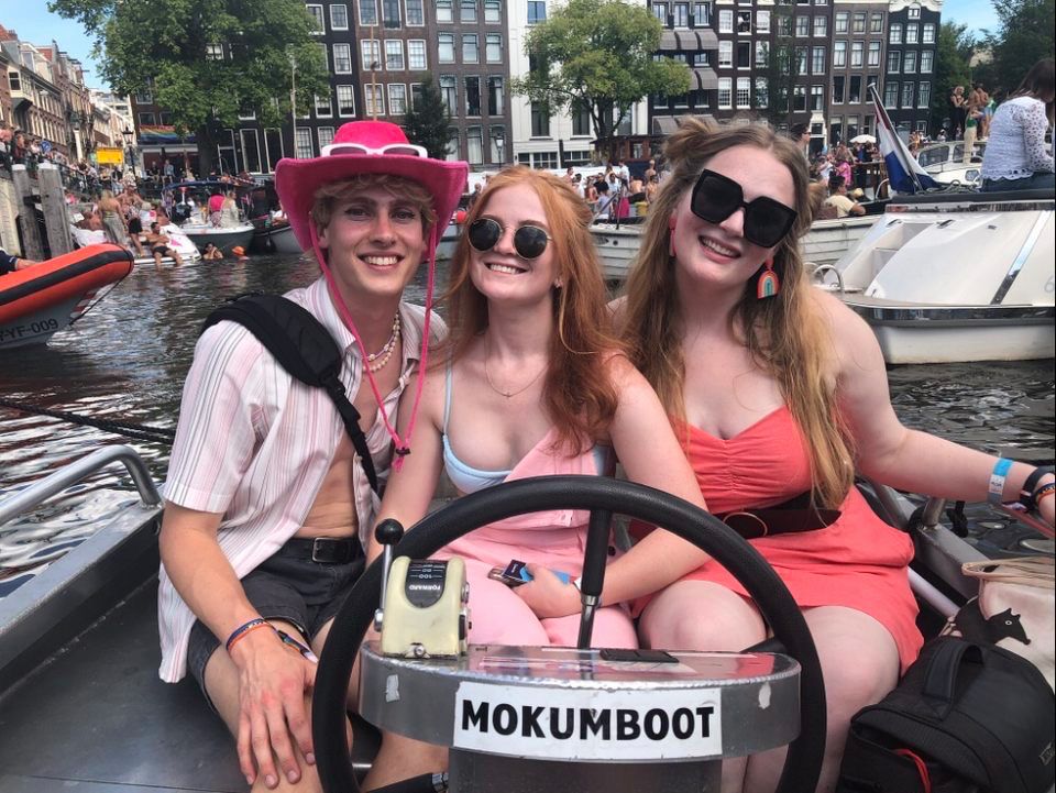 Alex with other MSU students in boat during Canal Pride Parade