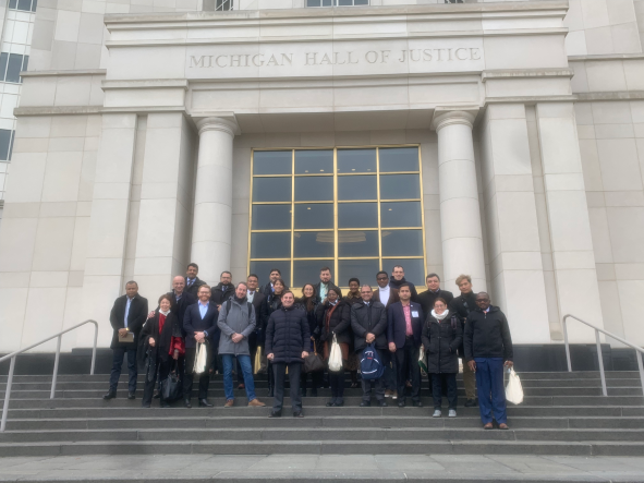 Group of people in front of Michigan Hall of Justice