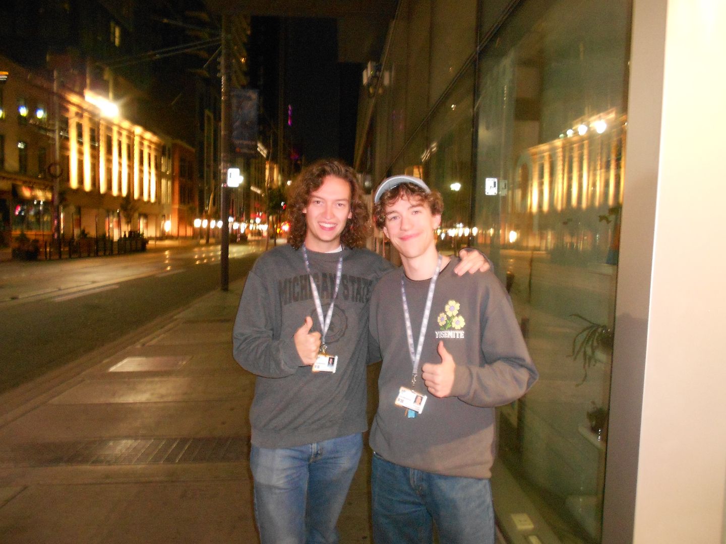 Jonathan and friend posing on the streets of Toronto at night