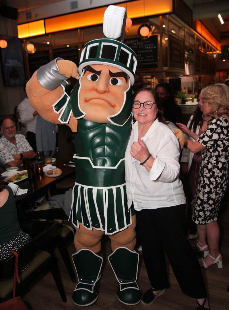 Renee Greening poses with Sparty