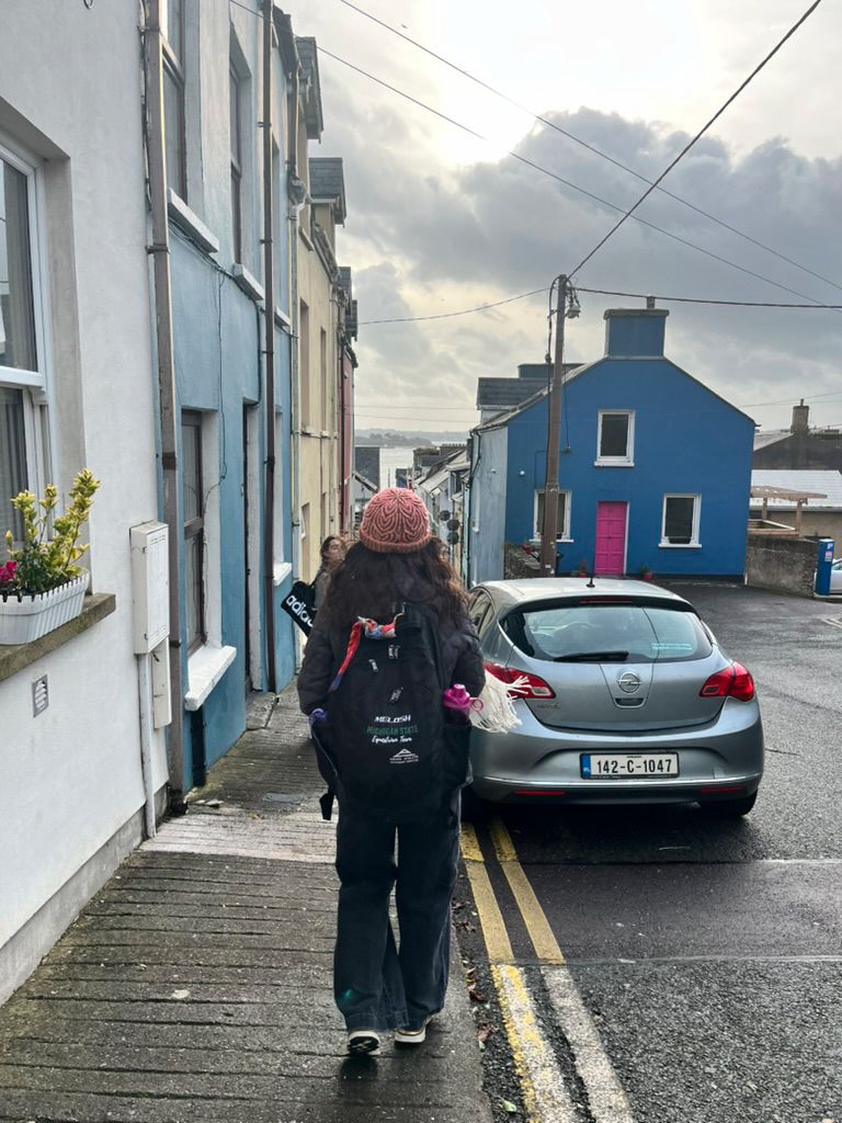 McKenzie walking on a local Irish street towards the sea