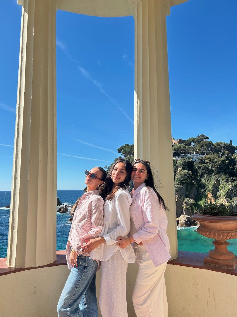 Avery and friends posing by the sea