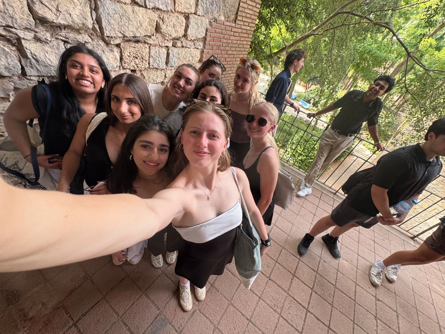 Monika and friends taking a selfie on a patio in Spain