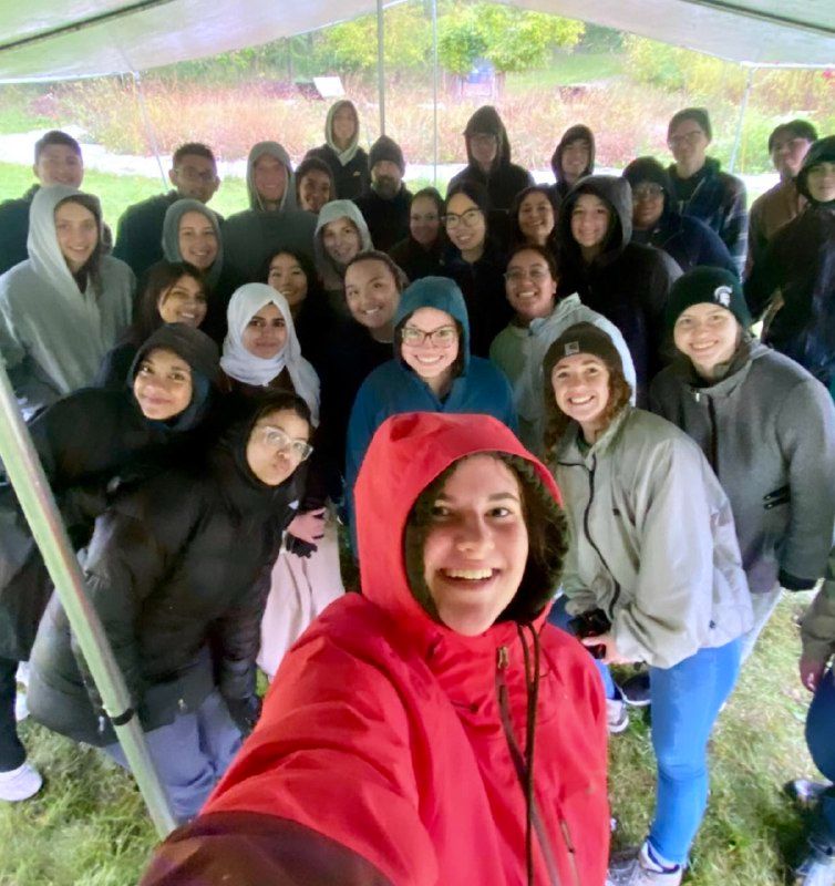 A group of volunteers smile at the camera